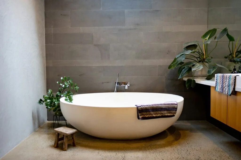 Bathroom remodeling in Terre Haute with freestanding soaking tub and floor-mount filler and tiled flooring