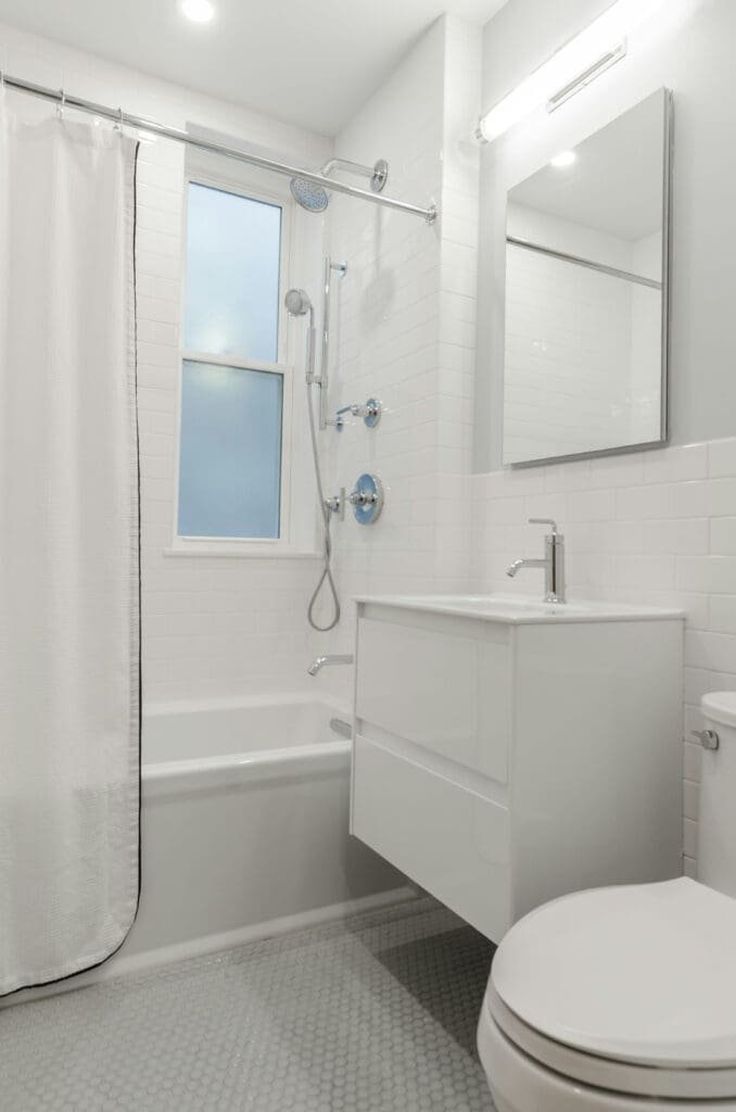 Beautiful bathroom remodeling completed by general contractor in Terre Haute featuring walk-in shower and modern fixtures.