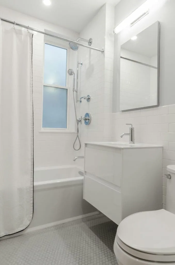 Beautiful bathroom remodeling completed by general contractor in Terre Haute featuring walk-in shower and modern fixtures.
