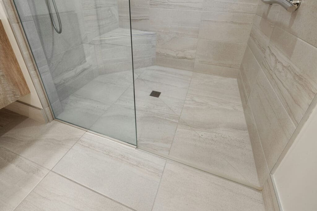 roll in tiled shower remodel with glass doors