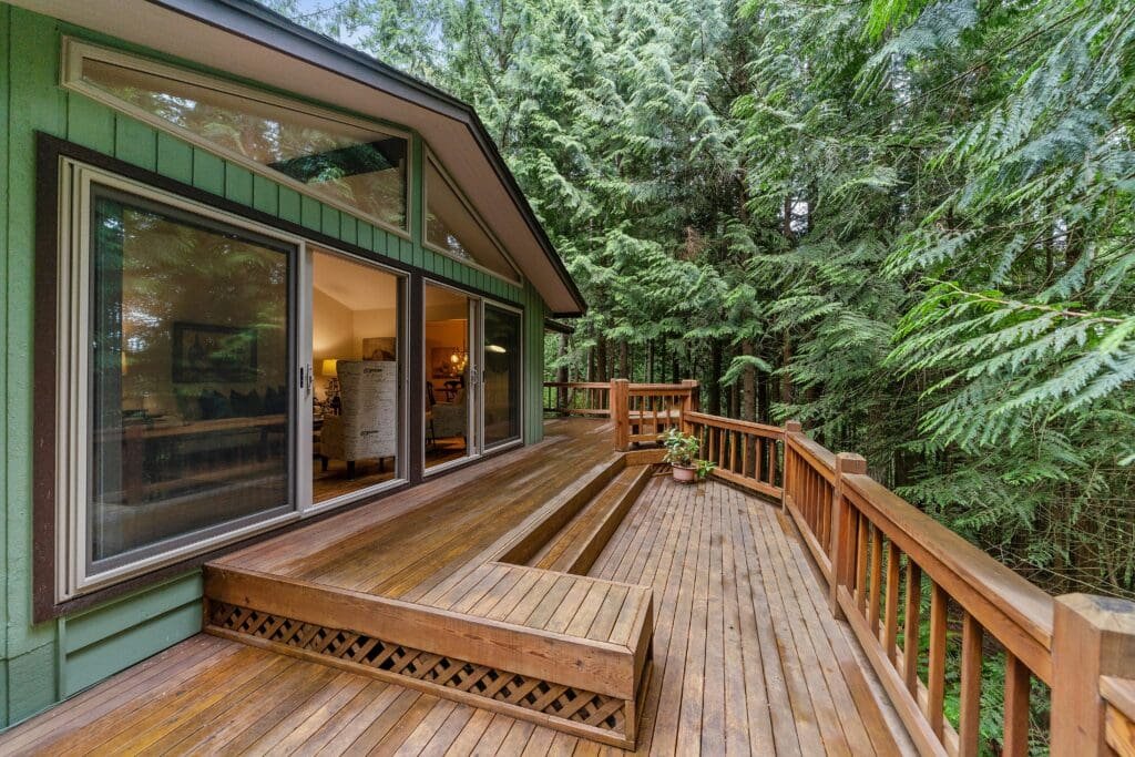 Pressure-treated wood deck in Indiana sealed and spaced to handle rain, snow, and humidity