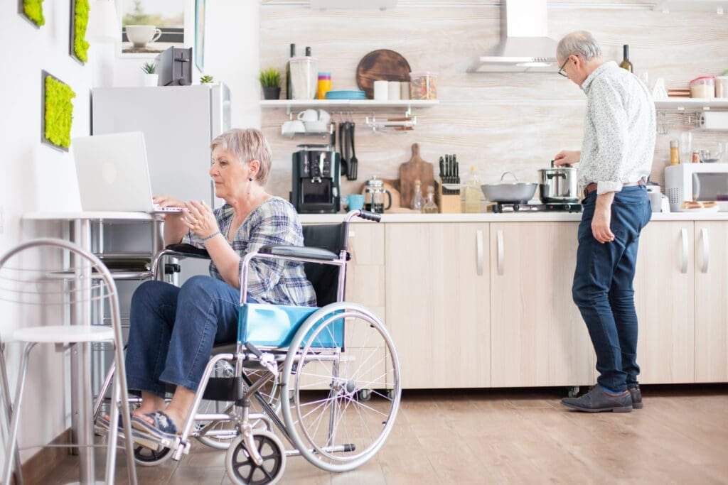 Modern accessible kitchen remodel in Terre Haute with lowered countertops, pull-out shelves, and under-cabinet lighting for seniors