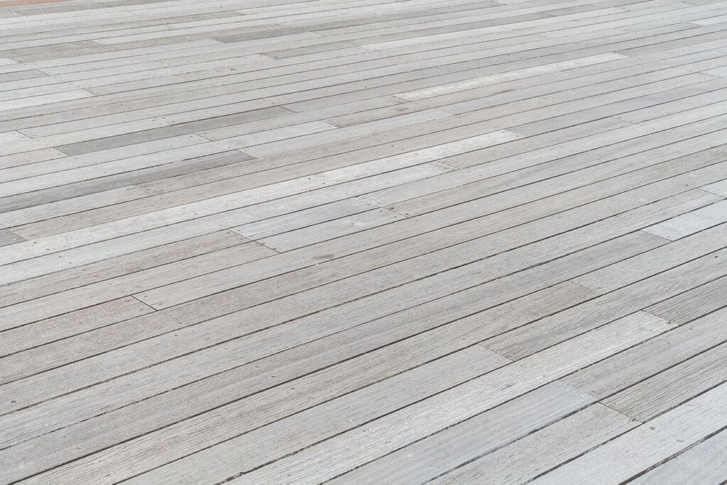 Light-gray capped composite deck in Terre Haute, Indiana with textured boards and hidden fasteners, built for Indiana freeze–thaw