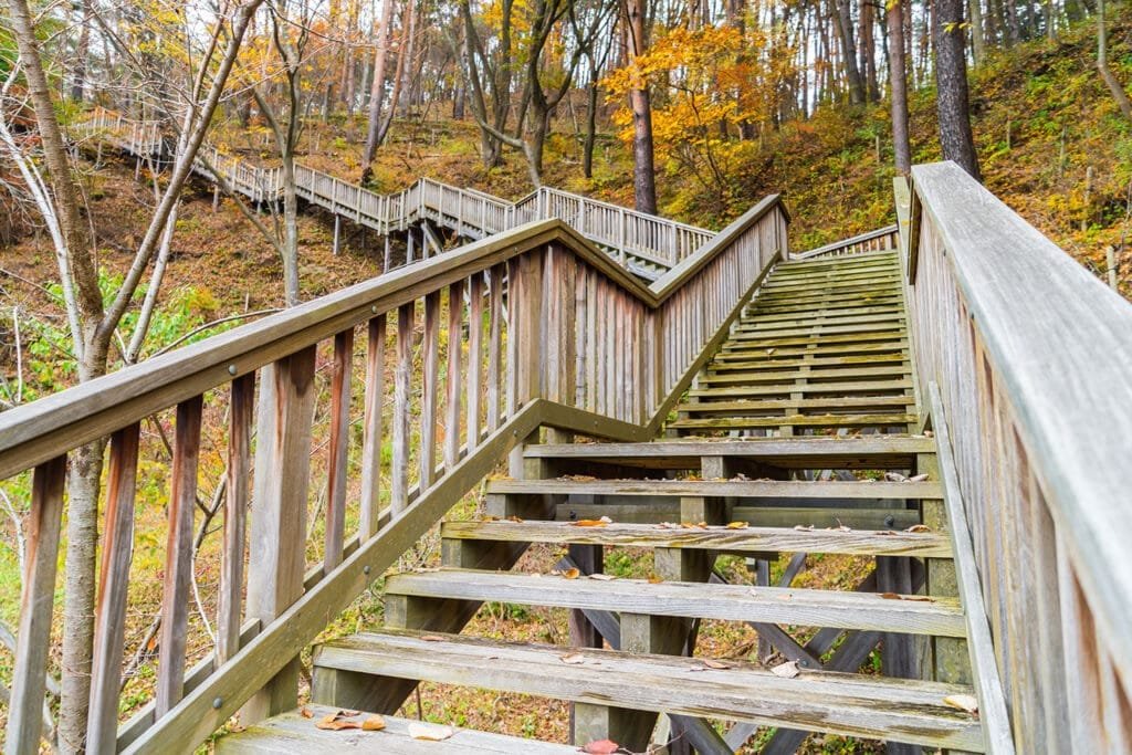 Deck stairs and railings in Terre Haute with graspable handrail and child-safe baluster spacing