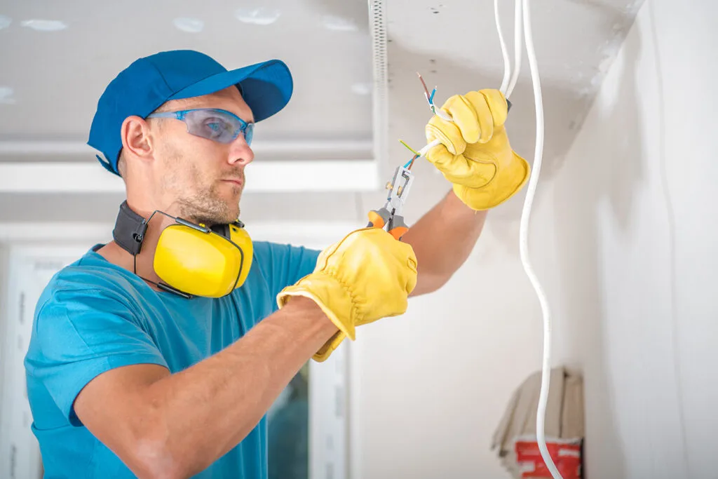 electrician working in a basement in Terre Haute