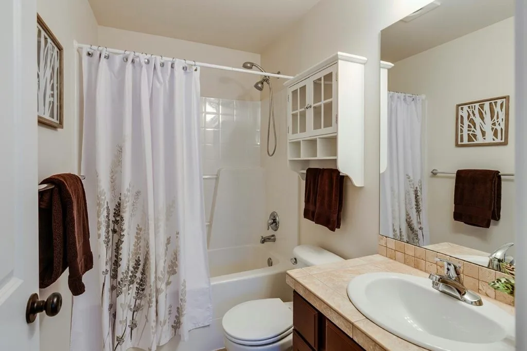 Small remodeled bathroom with a clear walking path, walk-in shower, and well-planned vanity layout in a Terre Haute home