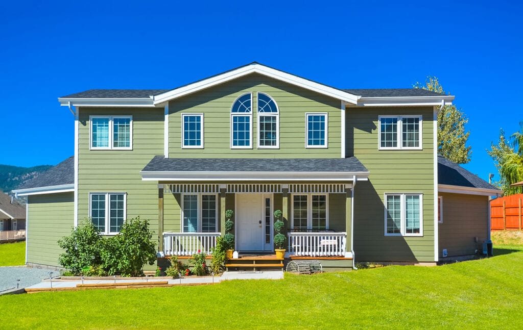 Modern home in Terre Haute with new horizontal lap siding, white trim, and clean front entry illustrating a complete siding replacement