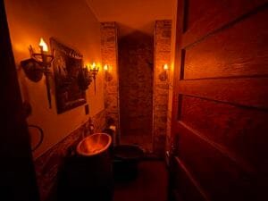 Gothic bathroom finished with just goblet and candel lights on