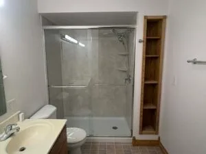 After of the walk in shower with Travertine shower walls